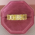 Detailed top view of gold luxury ring with seven yellow emerald-cut stones in pink velvet box - Size 5 / Emerald Cut (R4619) / Gold
