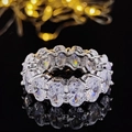 Macro detail of oval cut eternity ring with sparkling cubic zirconia on black mirror - Size 5 / Oval Cut Full Eternity White Style (r5343)