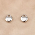 Polished silver heart-shaped earring studs displayed on champagne silk fabric - Minimalist Plain Surface Style / 10 Pieces/Pack (18.5x21mm) / Silver