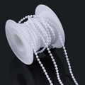 Close-up of white ABS pearl bead chain on a spool for DIY crafts and sewing decor - Round Pearl / 2.5mm (10m Pack) / White