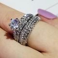 Luxe tweedelige zilveren ringenset met zes-potige solitair en pavé-zetting ringen - US 5 / Zilver
