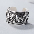 Macro detail of vintage silver elephant relief and woven textures on wide open ring - Adjustable Open / Antique Silver (White)