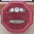 Elegant silver three-stone engagement ring set with pavé pavé bands in pink velvet box - US 5 / White