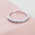 Elegant half-eternity silver ring with sparkling round zircons on a pink display stand - US 5 / Silver