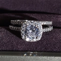 Luxurious silver ring set with round cut center stone and paved band in velvet box - US 5 / White