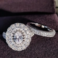 Luxury oval cut halo ring set with double row of diamonds on deep purple velvet background - US 5 / Silver