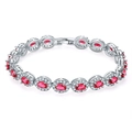 Elegant silver tennis bracelet with oval red gemstones and white zircon halo on white background - Oval Halo Style (KSB00053) / Red