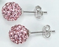 Macro shot of pink crystal sphere stud earrings with secure butterfly backs - Pink