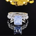 Elegant silver ring set featuring a rectangular blue gemstone and sparkling zircon accents - US 6 / White