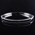 Elegant silver-tone bangle with inset black rectangular stones and a polished finish - Silver With Black Stone