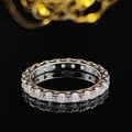 Classic silver eternity ring set with round-cut sparkling stones on a black mirror surface - Size 5 / Round Cut Eternity Band White Style (r5627)