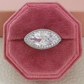Elegant marquise-cut diamond halo ring displayed in an octagonal pink velvet jewelry box - US 6 / White