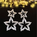 Sparkling silver double star hollow earrings with white crystals on a black background - White