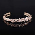 Irregular rose gold cuff bracelet featuring rectangular crystal stones and open design - Rose Gold Wave Geometric Style