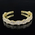 Irregular adjustable open bangle in gold finish with rectangular cubic zirconia stones - Golden Zircon Row