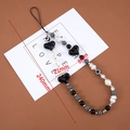 Detail view of black heart charm beaded phone strap with 240mm length measurements - 1 Piece / Galaxy Heart Bead