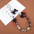 Détails de dragonne téléphone noire et blanche avec nœud, cœur et perles, longueur 220mm - 1 Pièce / Perle Papillon Pop