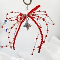 Handmade red beaded butterfly keychain with crystal charms and a silver spring clasp - Red