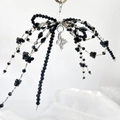 Handmade black beaded bow keychain with silver butterfly pendant and clear heart charm - Black