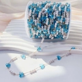 Detail of 4mm pearl and blue butterfly bead chain on white spool for DIY jewelry making - 0.5 Meters/Pack / Blue