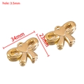 Golden CCB bow-knot heart pendant charms for DIY jewelry making with dimensions 34x23mm - Bow / Gold