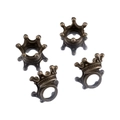 Detail of four antique bronze crown charms for DIY jewelry making on white background - Antique Bronze