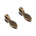 Detailed macro view of two antique bronze alloy charms with hollow mesh texture pattern - Antique Bronze