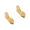 Detailed view of two gold alloy jewelry charms with dimpled texture and polished finish - Gold