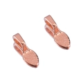 Detailed macro view of two rose gold pinch bails with dotted texture for DIY jewelry - Rose Gold