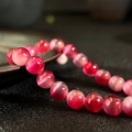 Rosa Katzenauge-Perlen für DIY-Armbänder mit dezentem Farbverlauf und poliertem Finish - Fuchsie