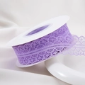 Detail of purple lace ribbon with floral mesh and wavy edges on white spool - 30mm-22m / Violet