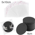 Detail of black earring display cards with clear plastic packaging bags and bow studs - Round / Black