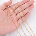 Delicate 4mm gold plated copper chain with clear round crystals held in hand - 0.5 Meters/Pack / White