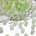 Macro shot of 8mm translucent pale green Czech beads for DIY jewelry making - 100 Pcs/Pack / Light Green-8mm