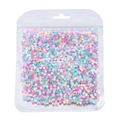 Primo piano di paillettes floreali colorate macaron in busta trasparente per nail art fai da te - Paillettes Colorate-Fiorellino