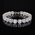 Close-up of silver tennis bracelet featuring prong-set cubic zirconia on black background - Classic Tennis Style (s7217) / Silver