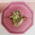 Golden dragonfly ring with olive green marquise gemstone in a pink velvet jewelry box - US 6 / Green