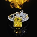 Luxurious flower ring with emerald-cut yellow zircon and sparkling white side stones - US 5 / Yellow
