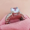 Luxury AAA zircon ring with round center stone and baguette-cut side stones in silver - US 6 / White
