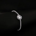 Elegant silver tennis bracelet featuring a central round halo diamond and shimmering chain - Silver