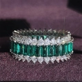 Luxe silver ring with emerald-cut green gems and white pavé accents on purple velvet - US 5 / Green