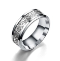 Macro shot of silver stainless steel ring with Celtic dragon pattern and polished edges - US 13 / Silver
