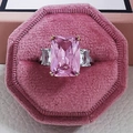 Macro detail of radiant pink crystal ring with white zircon in a luxury velvet box - US 5 / Pink