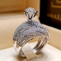 Luxury couple wedding ring set with round six-prong center diamond and pave accents - Size 5 / Six-Claw Round Luxury Style (r4991) / Silver