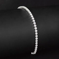 Macro detail of single row tennis bracelet with 3mm cubic zirconia in silver setting - 2.5mm Platinum 18cm