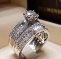 Luxurious silver couple ring set with six-prong round diamond and paved crystals - Baguette Guard Ring Set (R5335)