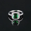 Luxurious halo ring featuring a cushion-cut green gemstone and silver pave band - Green