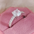 Exquisite silver ring with large round solitaire zircon and pave-set side stones - US 5 / White