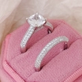 Elegant silver wedding ring set with cushion cut center stone in pink velvet box - US 5 / White