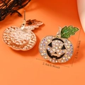 Detail view of crystal-encrusted pumpkin earrings with dimensions 2.7cm by 2.4cm - AB Rhinestone
